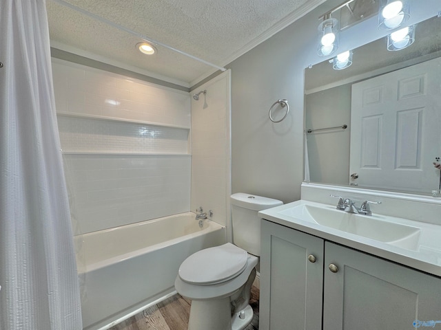 full bathroom featuring a textured ceiling, hardwood / wood-style flooring, toilet, shower / bath combo with shower curtain, and vanity