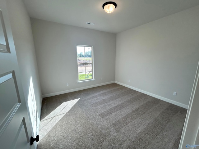 unfurnished room with carpet floors