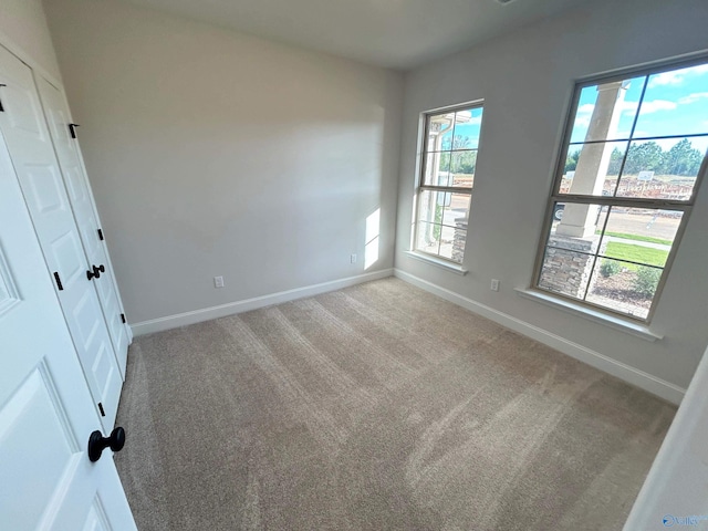 24081 Quints Dr, Athens, AL 35613 - empty room with baseboards and carpet floors