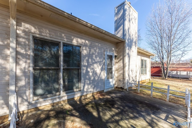 view of property exterior featuring a patio area