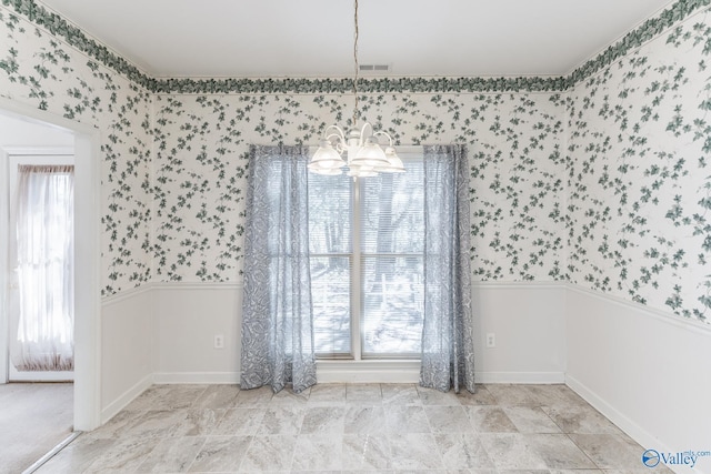 empty room with a notable chandelier