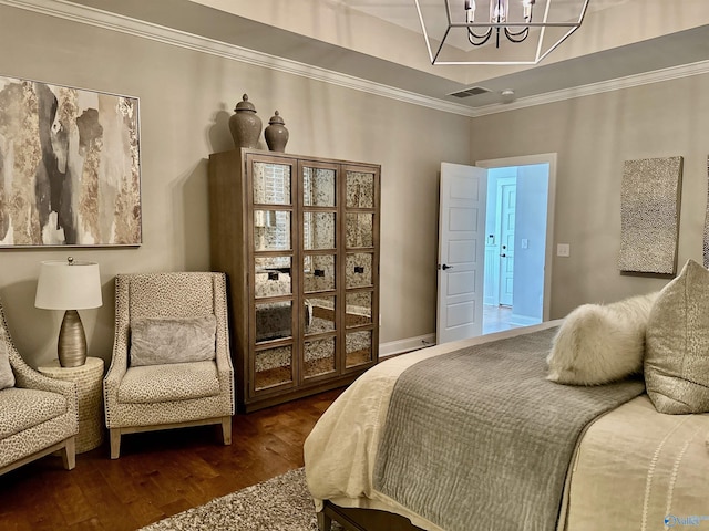 bedroom featuring dark wood-style floors, ornamental molding, visible vents, and an inviting chandelier