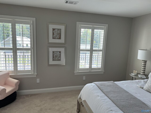 carpeted bedroom featuring ornamental molding