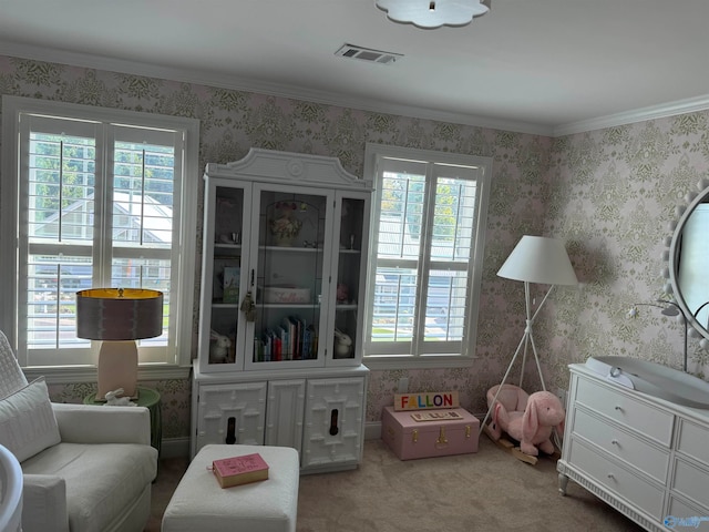 living area featuring ornamental molding and carpet flooring