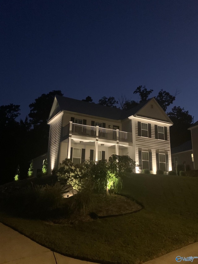 view of front of home with a balcony