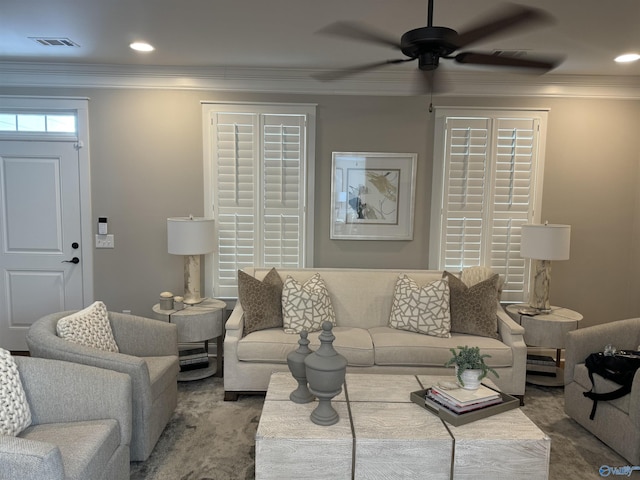 living area featuring a ceiling fan, visible vents, crown molding, and recessed lighting