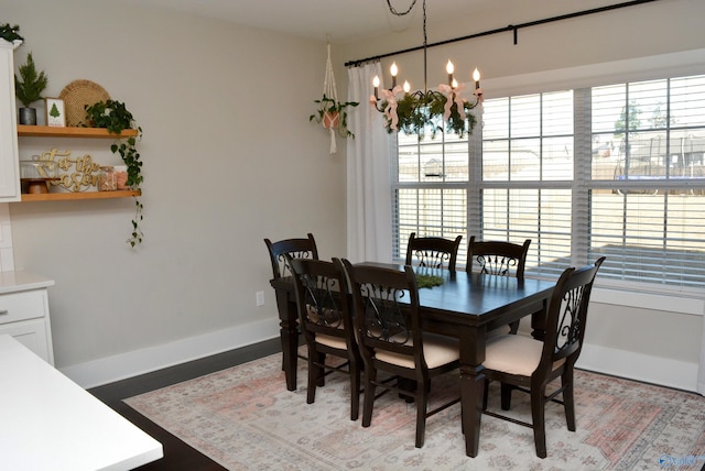 dining area featuring a notable chandelier