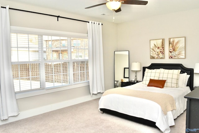 bedroom with ceiling fan and carpet