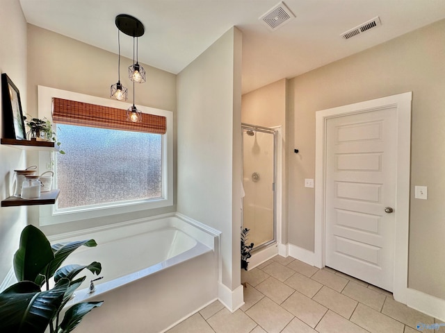 bathroom featuring separate shower and tub