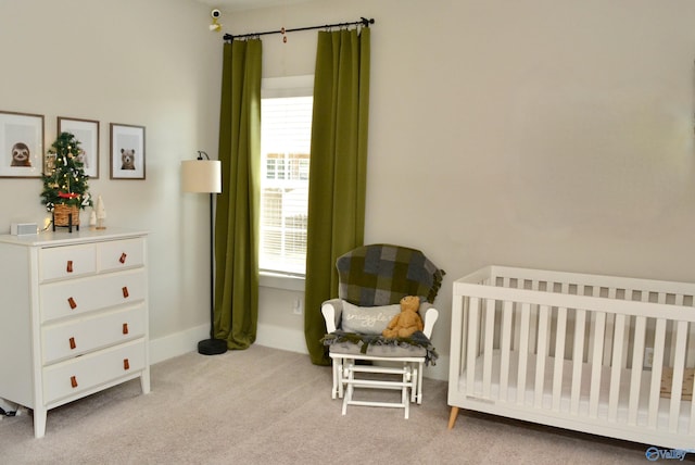 carpeted bedroom with a crib