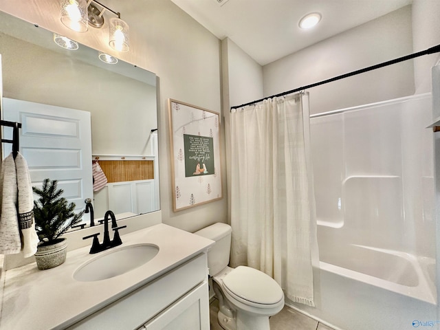 full bathroom with tile patterned flooring, vanity, shower / bath combo, and toilet