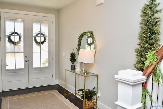 doorway to outside featuring french doors and dark wood-type flooring