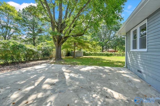 view of patio / terrace with a storage unit