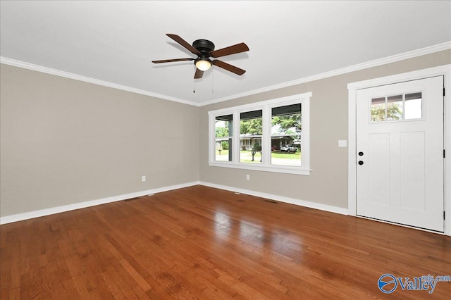 entryway featuring a healthy amount of sunlight, crown molding, ceiling fan, and hardwood / wood-style flooring