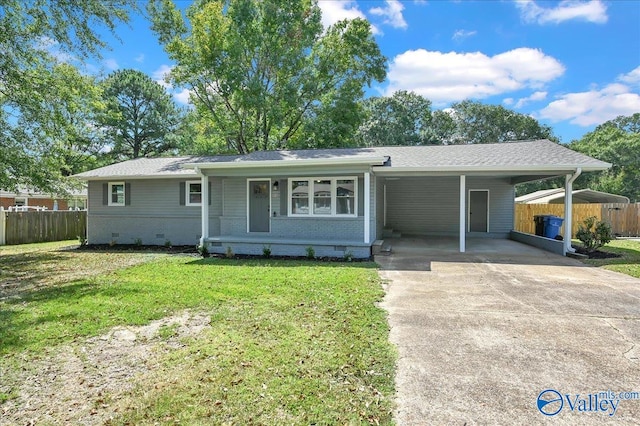 ranch-style home featuring a carport and a front yard