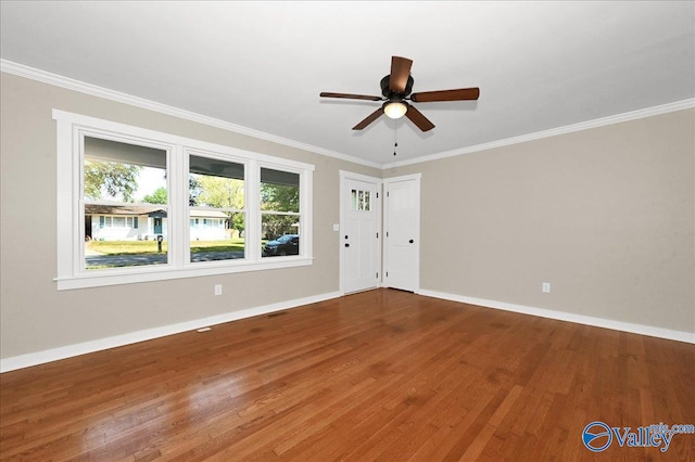 unfurnished room featuring ornamental molding, ceiling fan, and hardwood / wood-style floors