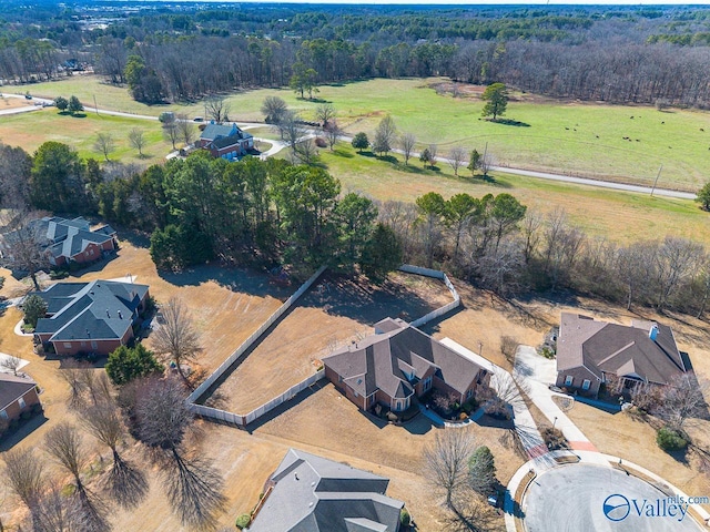 birds eye view of property with a rural view and a view of trees