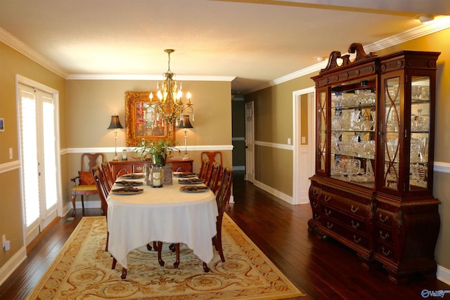 dining room featuring a wealth of natural light, wood-type flooring, and ornamental molding