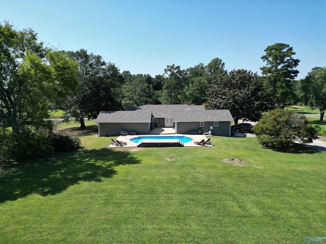 view of yard featuring a patio area and an outdoor pool