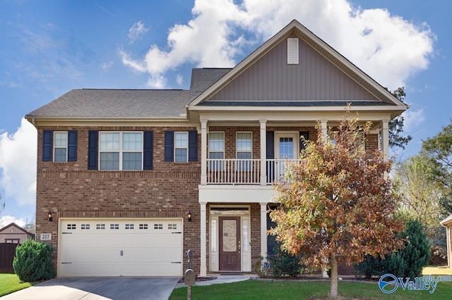 217 Skehan St SW, Huntsville, AL 35824 - view of front of property featuring brick siding, driveway, a garage, board and batten siding, and a balcony