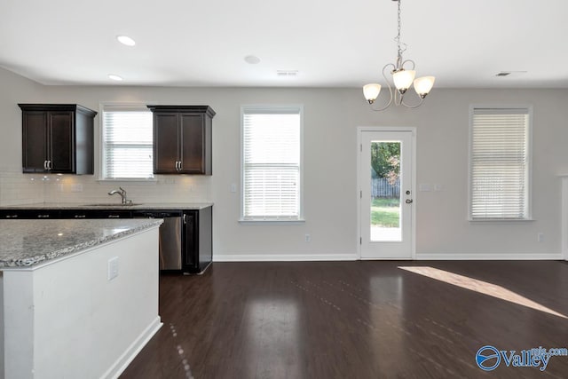 217 Skehan St SW, Huntsville, AL 35824 - kitchen with stainless steel dishwasher, dark wood finished floors, healthy amount of natural light, tasteful backsplash, and recessed lighting
