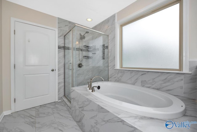 217 Skehan St SW, Huntsville, AL 35824 - full bathroom with a bath, marble finish flooring, a marble finish shower, and recessed lighting