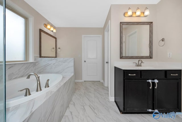 217 Skehan St SW, Huntsville, AL 35824 - full bathroom featuring vanity, marble finish flooring, and a garden tub