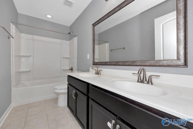 full bathroom featuring toilet, tub / shower combination, vanity, and tile patterned floors