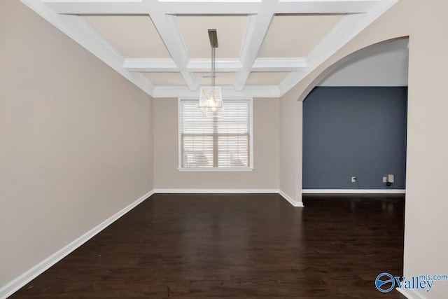 217 Skehan St SW, Huntsville, AL 35824 - spare room featuring arched walkways, dark wood-style flooring, beam ceiling, and coffered ceiling