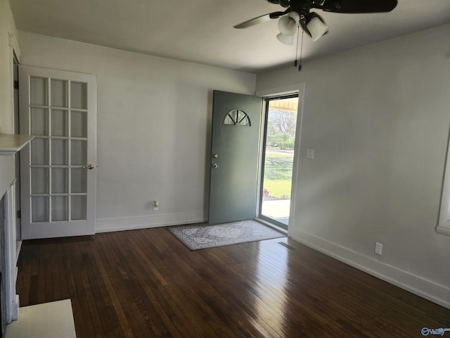 entrance foyer featuring baseboards, visible vents, hardwood / wood-style flooring, and a ceiling fan