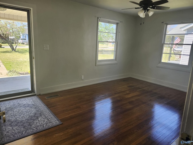 entrance foyer featuring visible vents, baseboards, hardwood / wood-style floors, and ceiling fan