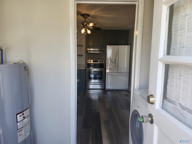 interior space with electric water heater, white fridge with ice dispenser, electric range, under cabinet range hood, and washer / dryer