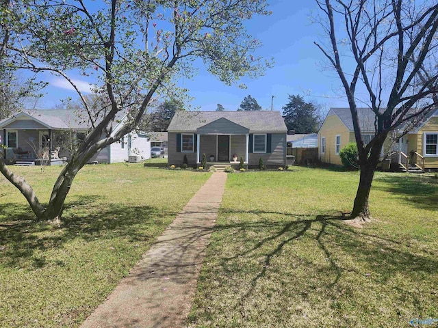 bungalow-style house featuring a front yard