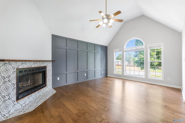 123 Turtle Ridge Dr, New Market, AL 35761 - unfurnished living room with a ceiling fan, wood finished floors, a tile fireplace, and high vaulted ceiling