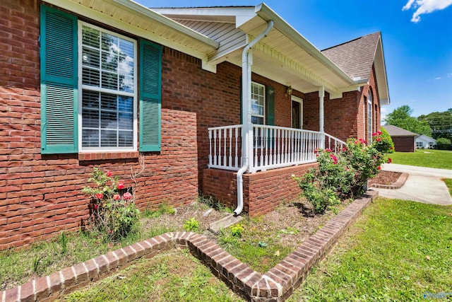 123 Turtle Ridge Dr, New Market, AL 35761 - view of property exterior with a porch, brick siding, roof with shingles, and a yard