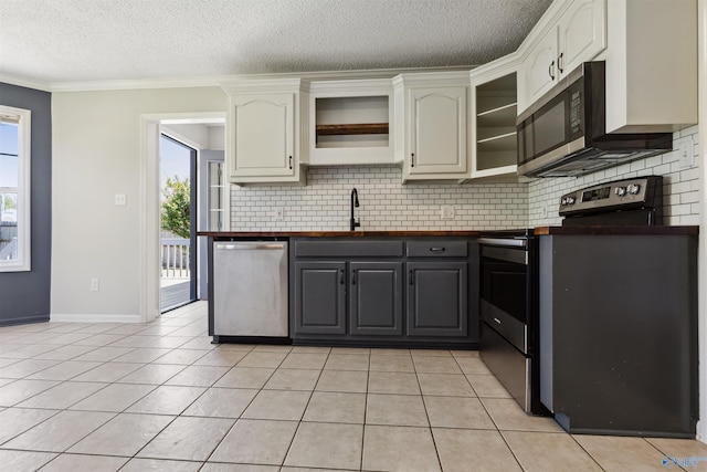 123 Turtle Ridge Dr, New Market, AL 35761 - kitchen with appliances with stainless steel finishes, open shelves, a sink, tasteful backsplash, and a textured ceiling