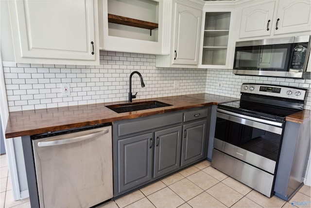 123 Turtle Ridge Dr, New Market, AL 35761 - kitchen with stainless steel appliances, a sink, butcher block countertops, and open shelves