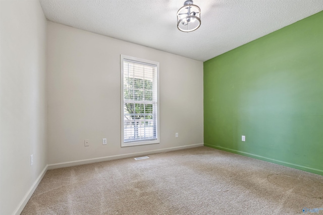 123 Turtle Ridge Dr, New Market, AL 35761 - empty room featuring carpet, a textured ceiling, and baseboards