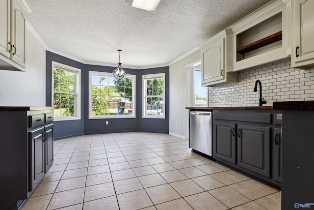 123 Turtle Ridge Dr, New Market, AL 35761 - kitchen with dishwasher, backsplash, a chandelier, light tile patterned flooring, and crown molding