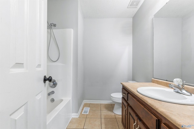 123 Turtle Ridge Dr, New Market, AL 35761 - bathroom featuring tile patterned floors, toilet, a textured ceiling, vanity, and tub / shower combination