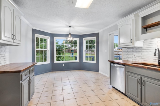 123 Turtle Ridge Dr, New Market, AL 35761 - kitchen with butcher block countertops, a sink, gray cabinets, stainless steel dishwasher, and decorative backsplash