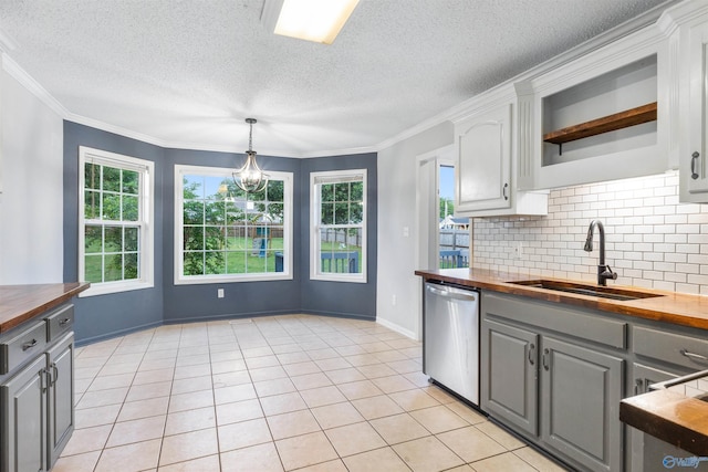 123 Turtle Ridge Dr, New Market, AL 35761 - kitchen featuring butcher block counters, dishwasher, a sink, gray cabinetry, and a textured ceiling
