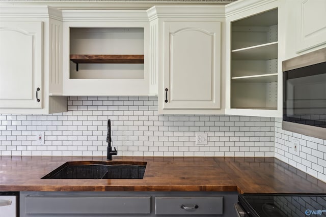 123 Turtle Ridge Dr, New Market, AL 35761 - kitchen featuring wood counters, a sink, open shelves, and tasteful backsplash