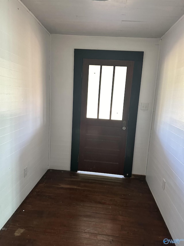 doorway to outside with wood-type flooring