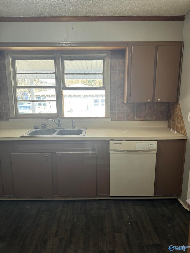 kitchen featuring sink, a textured ceiling, white dishwasher, dark hardwood / wood-style flooring, and decorative backsplash