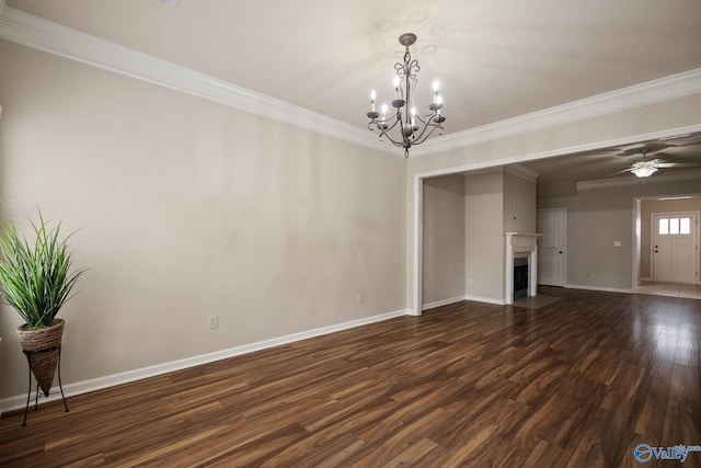 unfurnished living room with ceiling fan with notable chandelier, dark wood-type flooring, a fireplace with flush hearth, baseboards, and ornamental molding