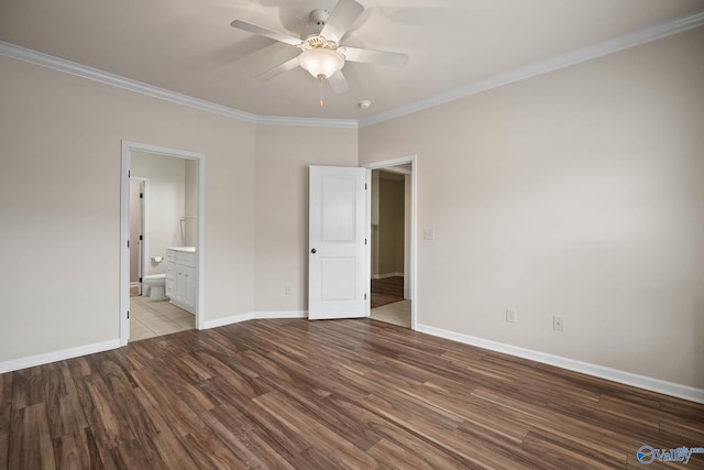 unfurnished bedroom featuring baseboards, a ceiling fan, light wood-style flooring, ornamental molding, and ensuite bathroom