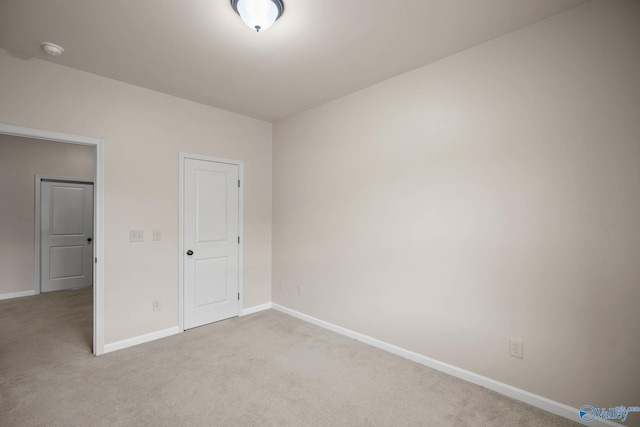 unfurnished bedroom with baseboards and carpet flooring