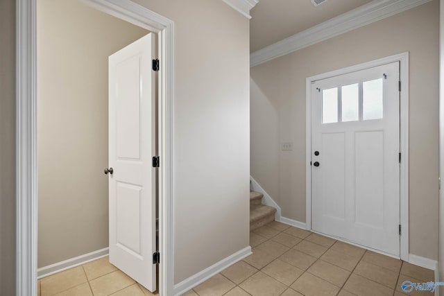 foyer featuring ornamental molding, stairway, baseboards, and light tile patterned floors