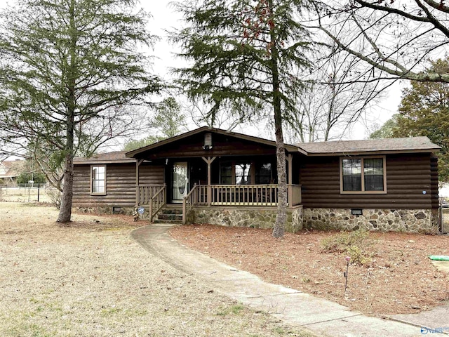 log-style house featuring a porch, crawl space, and a shingled roof